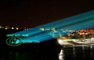 Photo of a logo projection indicating Group auto union international on the city of Biarritz