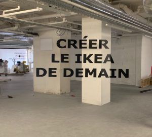 Photo of an underground car park with the text Create the Ikea of tomorrow projected on it
