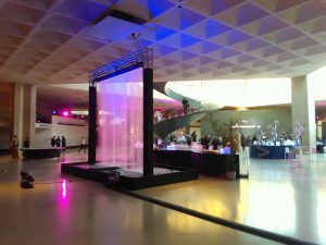 Photo of a pink water curtain inside the Louvres museum