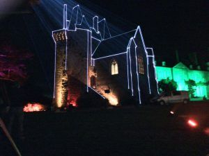 Photo of a building with laser outlines projection