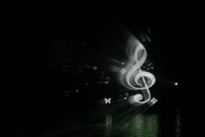 Photo of a white music note projected onto a water screen