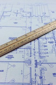 Photo of a blueprint with a ruler on it