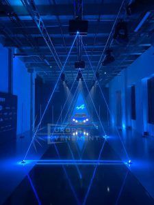 Photo of the alpine car with laser projection creating triangles