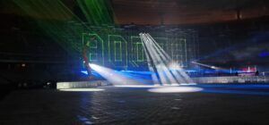 Scaffolding with letters Booba written with lasers on it