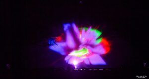 Projection of abstract multicolor shapes on a water screen