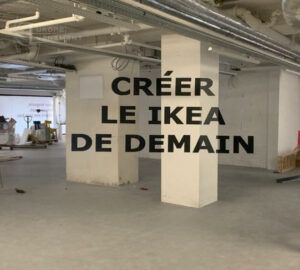 Europe Évènement - Photo of an underground car park with the text Create the Ikea of tomorrow projected on it