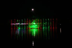 Europe Évènement - Photo of red and green fountain jets with smoke and green spiral laser projection