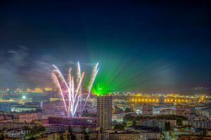 Europe Évènement - Photo of a tower with a projection of fireworks and green laser beams