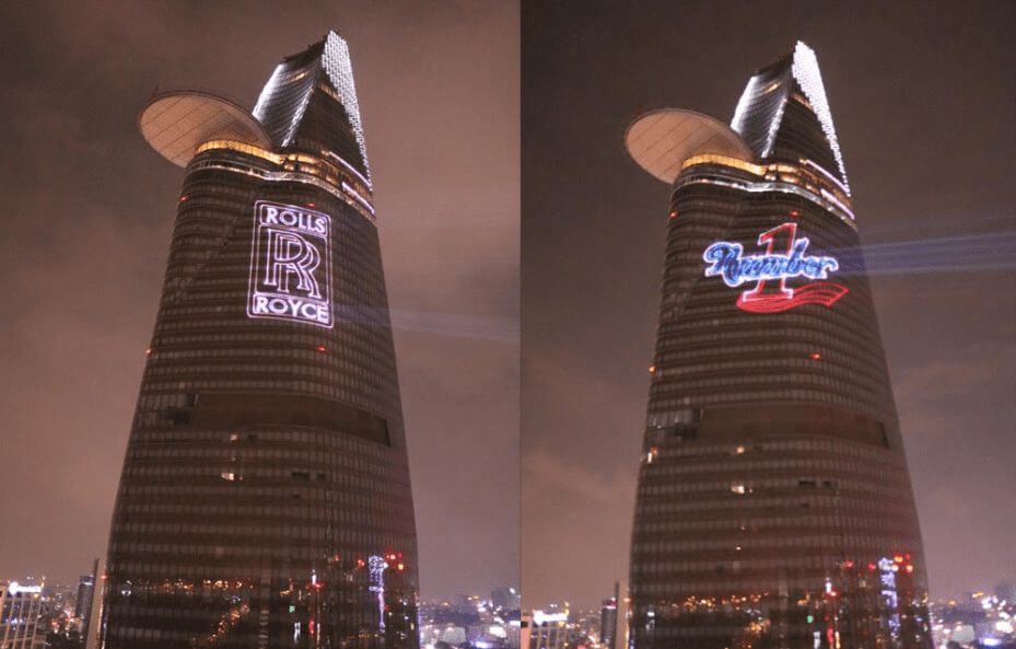 Europe Évènement - Projection de logo et écriture - Photo de deux tours à Ho Chi Minh avec deux logos de marques projetés sur chacune